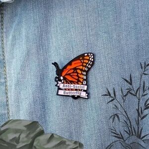 Anti social butterfly brooch pin